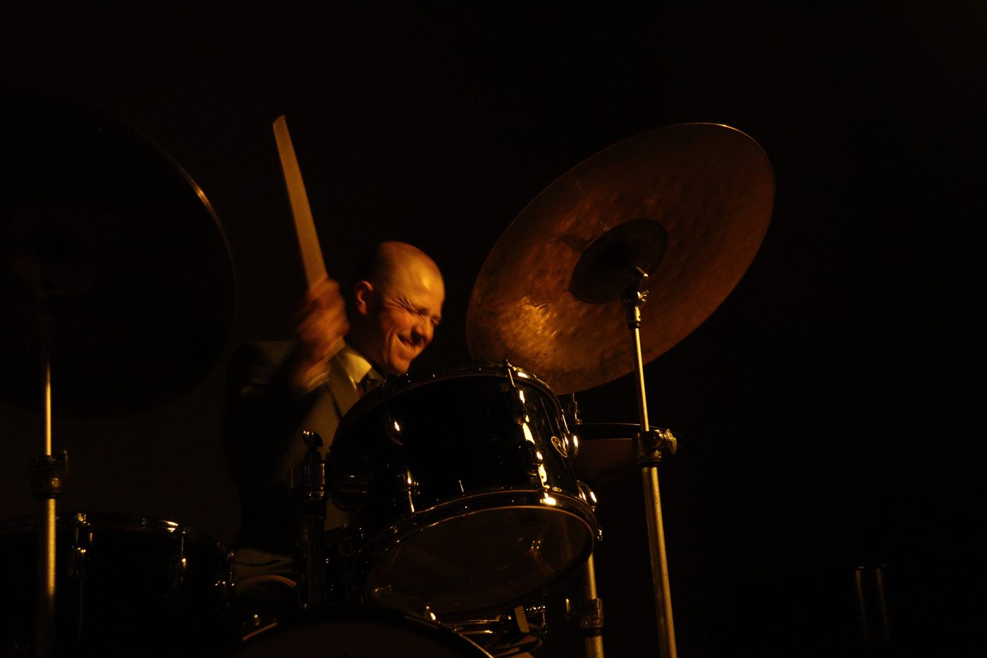Joey Porth playing drums with energy, mid-performance
