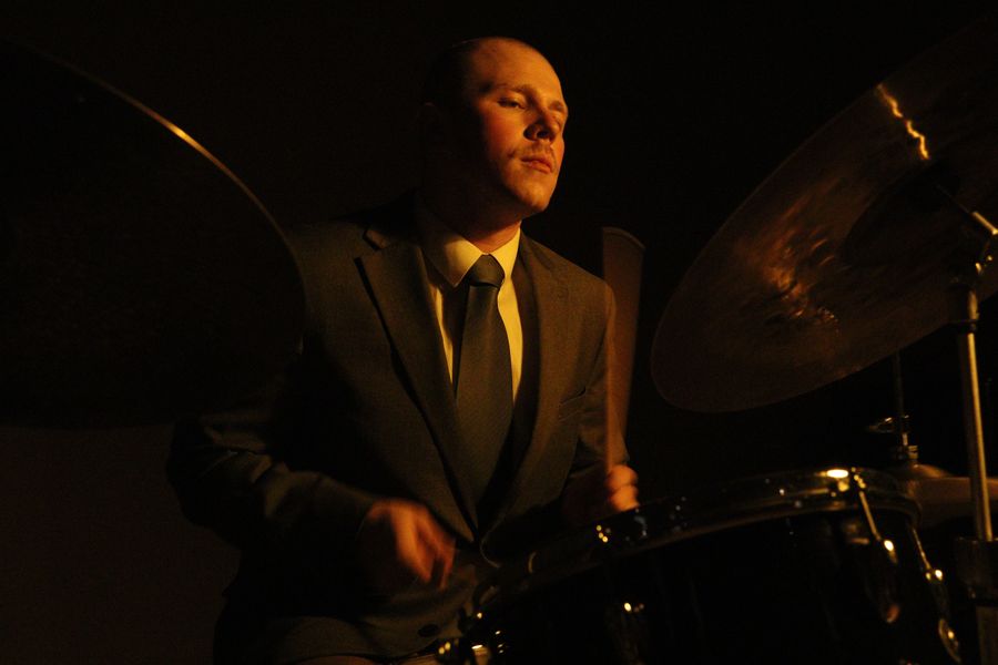 Joey Porth behind the kit, side lit